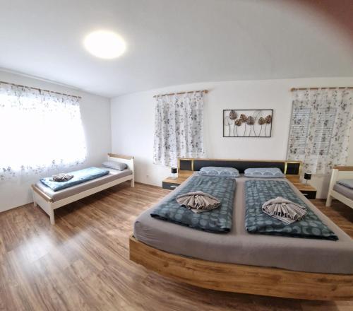 a bedroom with a large bed and a window at Apartment da Luiz Salvatore in Wurmlingen