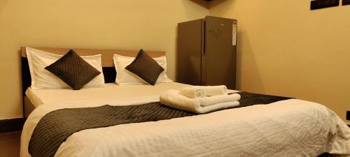 a bedroom with a bed with a stuffed animal on it at Cozy 1bhk with Terrace. in Lucknow