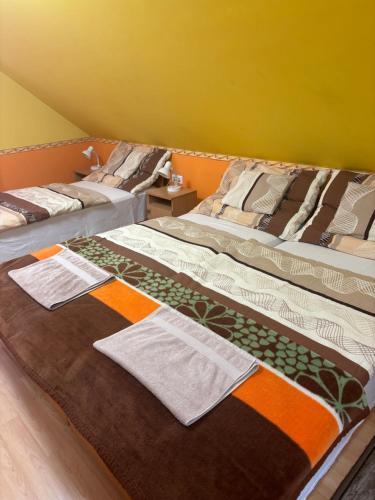 Кровать или кровати в номере Horvath Vendeghaz