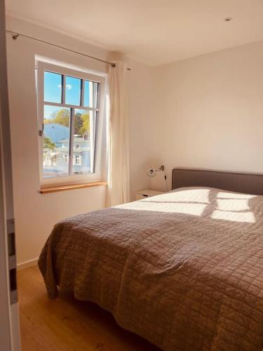 Postel nebo postele na pokoji v ubytování Lichtdurchflutetes Apartment mit Balkon