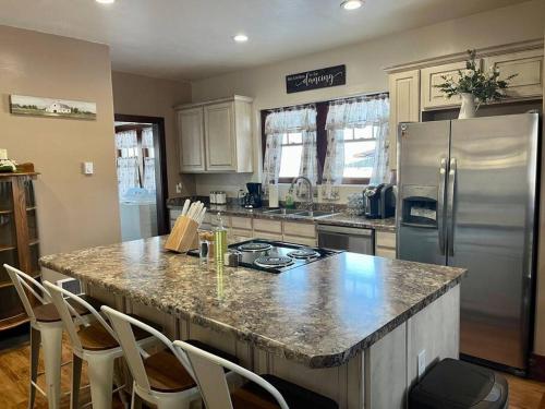 a kitchen with a counter top and a refrigerator at The Ely Airbnb in Ely