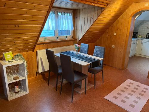 a dining room with a table and chairs at Ferienwohnung im Herzen Tribergs in Triberg