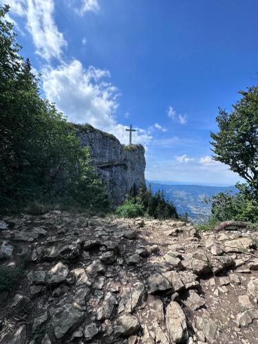 a cross on the top of a mountain at chambre au calme in Saint-Jean-dʼArvey