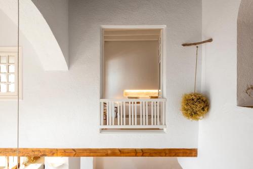 a mirror on a wall in a room at Casa Concha Apartamentos in Calella de Palafrugell