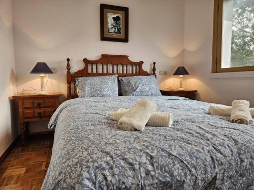 a bedroom with a large bed with pillows on it at 303A Casa Elisa Cudillero in Cudillero