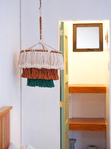 a room with a door with a hanging curtain at Urban Oasis Resort, Tarlac in Tarlac