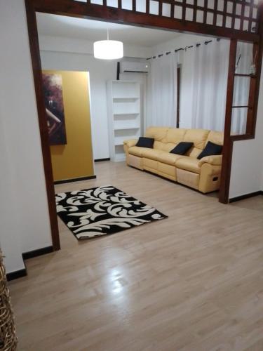 a living room with a couch and a rug at Red_Cross.Rent_Appartament in Palermo