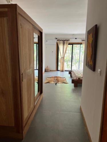 a hallway of a house with a room with a door at Chez Diarra in Saint-Louis