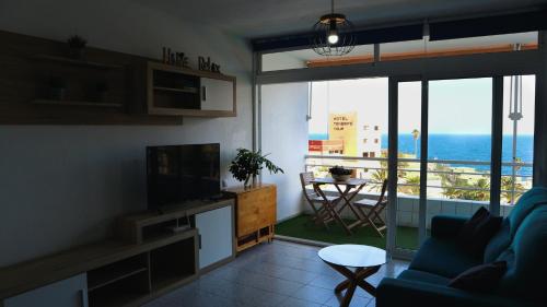 a living room with a view of the ocean at Apartamento Armonía in Candelaria