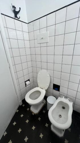 a bathroom with a toilet and a bidet at CASA EN LA FELIZ - pet friendly in Mar del Plata