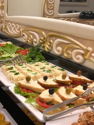 a display case with many different types of sandwiches at Grand Kavi Hotel in Istanbul