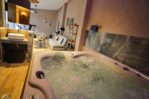 a bath tub in a bathroom with a sink at Pegasus' Glory House in Kavala