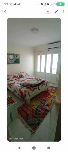 a bedroom with a bed and a rug on the floor at فيلا دوبلكس على البحر مباشره in Arish