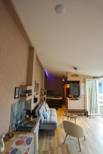 a living room with a couch and a table at Pegasus' Glory House in Kavala