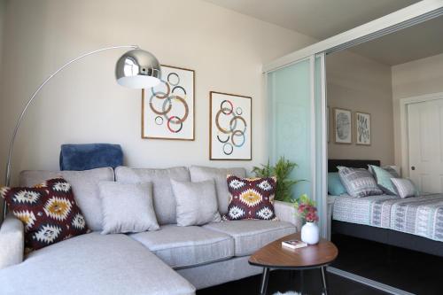 a living room with a couch and a bed at Queen Anne Retreat - 1 Blk from CPA - Free Parking in Seattle