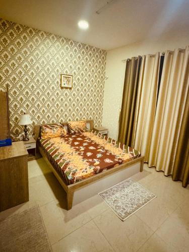 a bedroom with a bed in a room at Beautiful home in Ajman 
