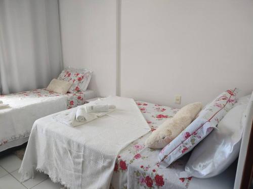 Tempat tidur dalam kamar di Conforto e Lazer