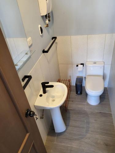 a bathroom with a sink and a toilet at Puerto Malabrigo, Plaza de Armas (Chicama, Peru) in Puerto Chicama