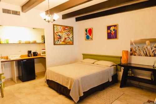 En eller flere senger på et rom på Villa Bougainvillea Aruba Rumba Suite