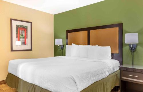 a large white bed in a hotel room at Extended Stay America Suites - Boston - Westborough - Computer Dr in Westborough