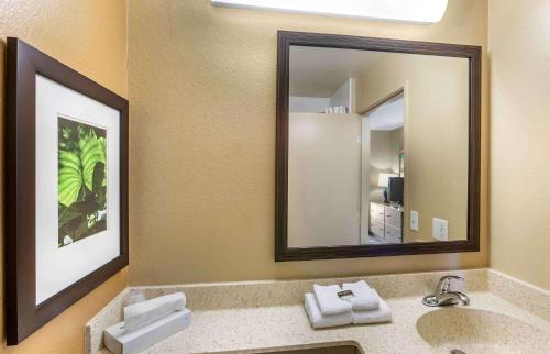 a bathroom with a sink and two mirrors at Extended Stay America Select Suites - Phoenix - Mesa - West in Mesa