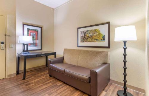 a waiting room with a couch and a lamp at Extended Stay America Suites - Atlanta - Gwinnett Place in Duluth