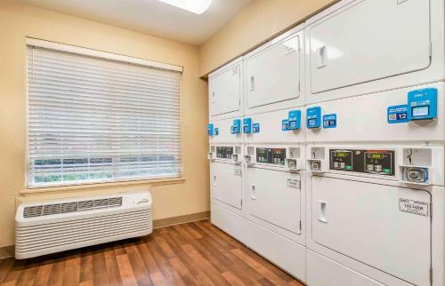 a room with a bunch of machines and a window at Extended Stay America Suites - Portland - Tigard in Tigard