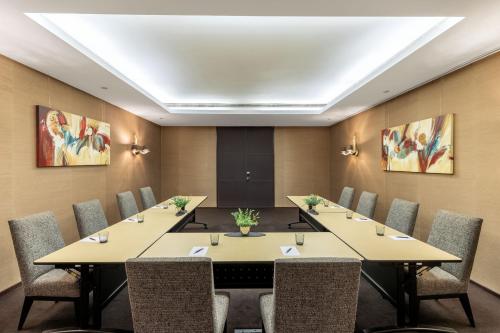 a conference room with a long table and chairs at Sheraton Lisboa Hotel & Spa in Lisbon