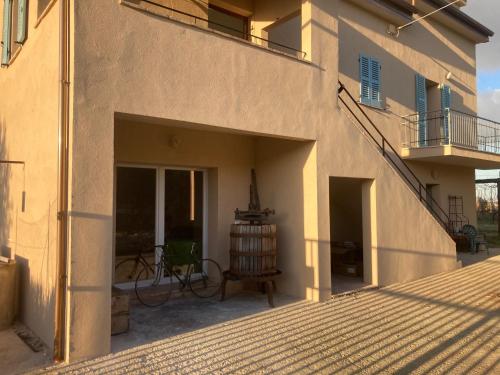 a patio of a house with a balcony at La Casa nell'Orto in Fermo