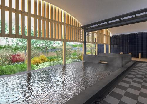 una casa con una piscina en el medio en OMO7 Kochi by Hoshino Resorts, en Kochi
