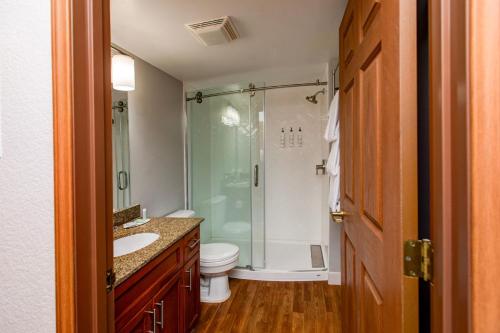 a bathroom with a shower and a toilet and a sink at TownePlace Suites Denver Southwest/Littleton in Littleton