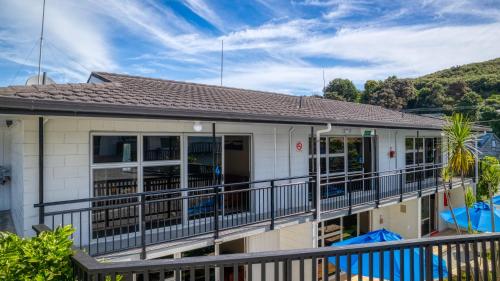 an image of a house with a balcony at The Captains Motel in Russell