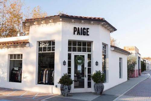 a white building with a price sign on it at SA Carbon Beach Suites in Malibu