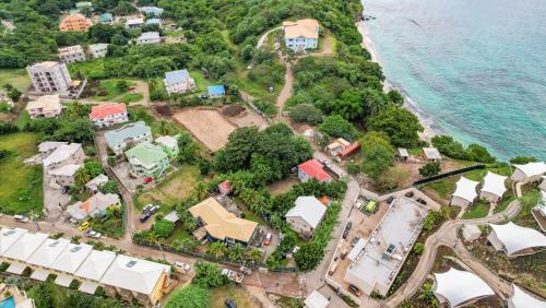 an aerial view of a house next to the ocean at Kaibus Place- Quaint Quiet and Cosy in Morne Rouge