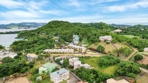 an aerial view of a resort near the water at Kaibus Place- Quaint Quiet and Cosy in Morne Rouge