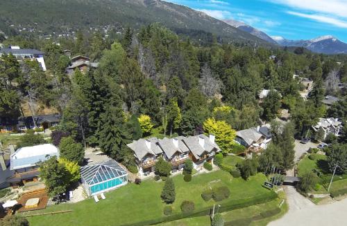 an aerial view of a house with a greenhouse at Pailahue Cabañas Lodge in San Carlos de Bariloche