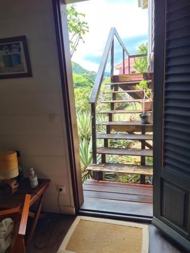 a view from the door of a house with a staircase at Les lofts Edouard in Terre-de-Haut