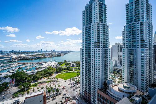 a view of a city with two tall buildings at TR Miami 2 Bedroom, 1 Bedroom, and Studio Condos with Balconies in Miami