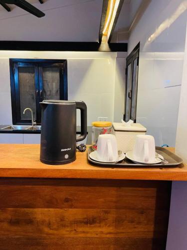 a coffee maker on a counter in a kitchen at Roya Khmer House in Siem Reap