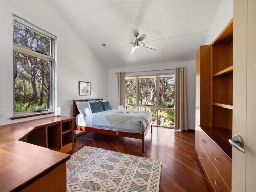 a bedroom with a bed and a window at Nature's Doorstep - Redgate Beach NEW in Margaret River Town