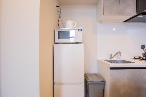 Una cocina o cocineta en The most comfortable and best choice for accommodation in Yoyogi SioY5