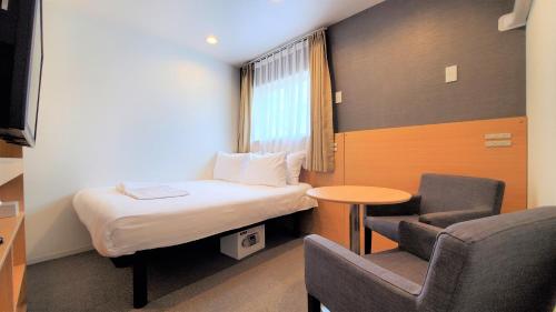 Tempat tidur dalam kamar di Hotel Passage 2