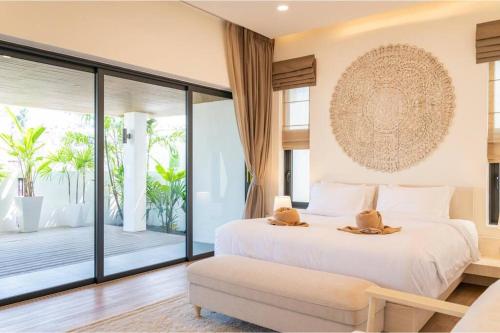 a bedroom with a large bed and a balcony at Modern Villa Walking Distance to Fisherman Village KBR15 in Amphoe Koksamui
