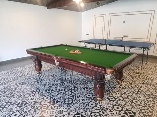 a pool table sitting on top of a floor at Raaj Resort in Panvel