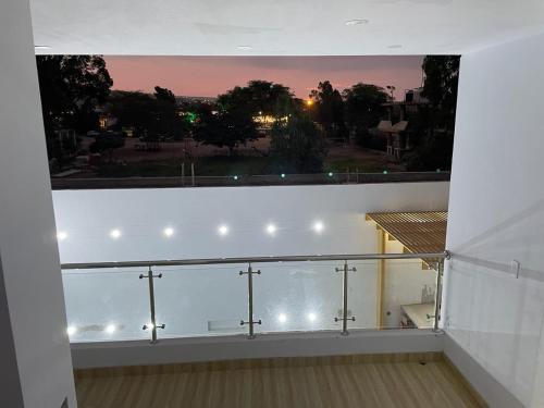 a balcony with a window with crosses on it at Hurin Hotel in Ica