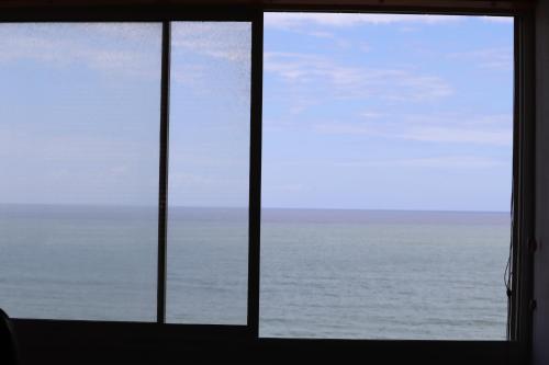 a view of the ocean from a window at Shangri-la Doonside in Kingsburgh
