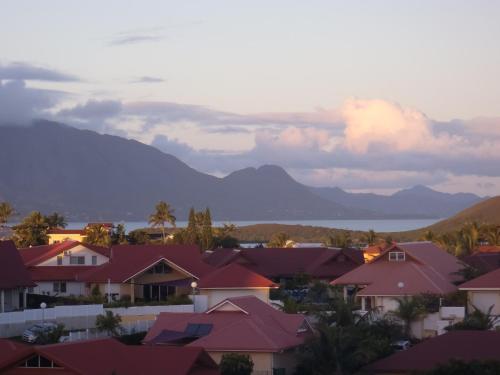 a view of a suburb with mountains in the background at villa utrillo in Noumea