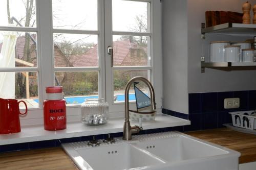 a kitchen counter with a sink and a window at Haus Ost in Mechelsdorf