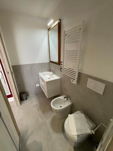 a bathroom with a toilet and a sink at Nonna Mina B&B in Rapagnano