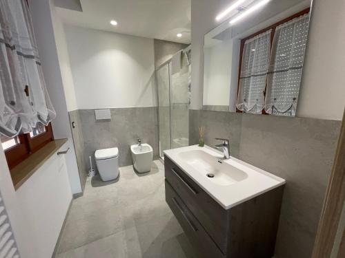 a bathroom with a sink and a toilet at Nonna Mina B&B in Rapagnano